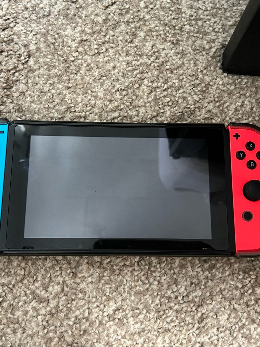 Nintendo Switch with Neon Blue Left and Neon Red Right JoyβCon